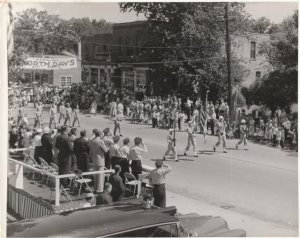 A black and white photo of a parade at Worth Days